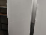 two white refrigerators in the kitchen next to each other