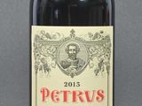 a bottle of red wine that is sitting on a table