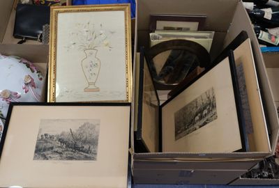 a box full of framed pictures and other items