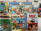 de nombreux albums de bandes dessinées exposés sur une table
