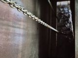 a chain hanging from the side of a building