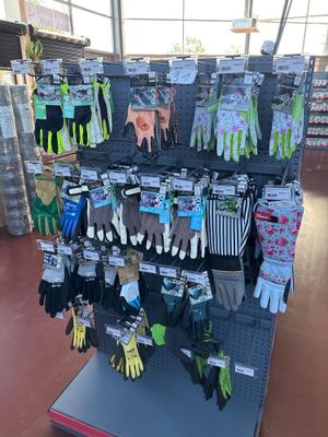 display of gardening gloves and gloves for sale in a store