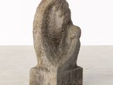 concrete sculpture of a woman ' s head on a base