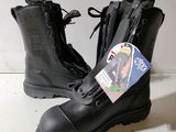 a pair of black boots with a tag on them