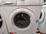 a washing machine and a dryer sitting next to each other