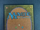 a close up of a magic the gathering card on a table