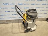 an image of a vacuum cleaner is on the floor in front of a wall