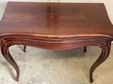 an image of a small table with a wooden top