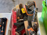 many tools that are sitting in a container on a table