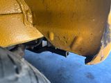 a close up view of the front end of a yellow truck