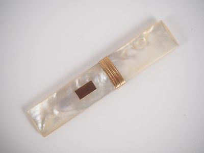 a close up of a piece of jewelry with a cross on it