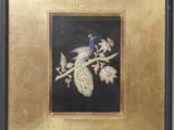 painting of a peacock sitting on a branch in a gold frame