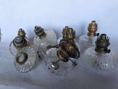 a lot of glass and brass items on a table