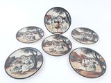 four plates with a picture of a man and a woman on them