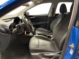 the interior of a blue car is clean and ready to be used