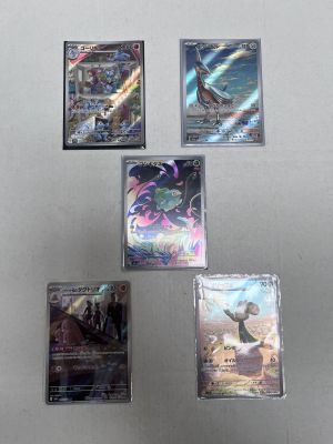 some of the pokemon cards are hanging on the wall
