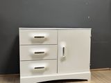 an image of a white dresser in a room
