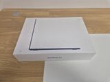a white box on a table with a laptop in it