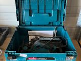 a blue tool box sitting on top of a wooden floor