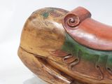a wooden sculpture of a horse with a saddle on it ' s back