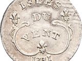 a close up of a coin on a white surface