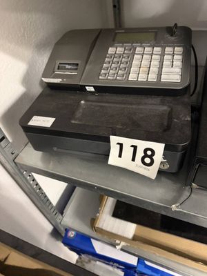 a cash register on a shelf in a store