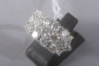 an image of a diamond ring on a black stand