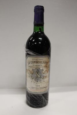 a bottle of wine that is sitting on a table