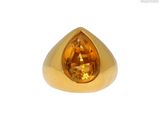 une image représentant une bague en or sertie d'une citrine facettée