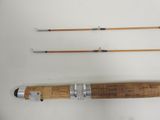 three different types of fishing rods on a white surface