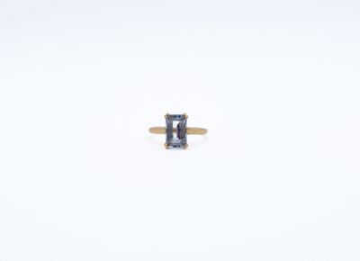 an image of a ring with a blue stone