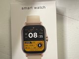 a box with a smart watch on it on a table