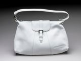 an image of a white purse on a gray background