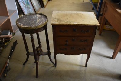 a small table with a marble top next to a small table with a marble top