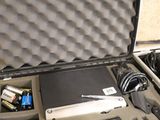 a case with a laptop and a microphone inside of it