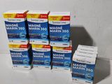 six boîtes de Magne Marine contenant chacune 300 comprimés, empilées les unes sur les autres