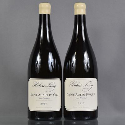 two bottles of wine sitting on top of a table next to each other
