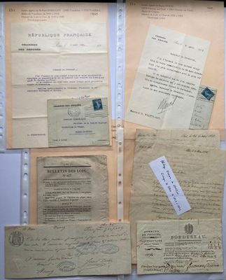 some old papers are sitting on top of each other on a table