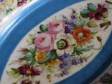 a blue and white plate with a floral design on it