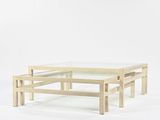 the table is made of wood and has a glass top