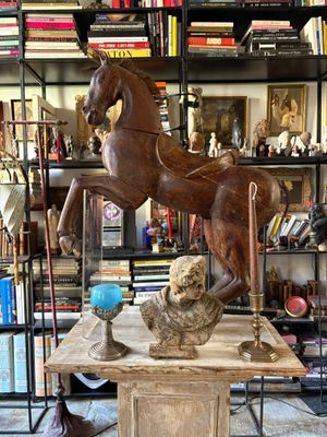 a statue of a horse and a dog on a table
