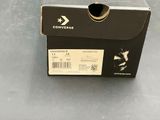 a black box with a white arrow on the side of it