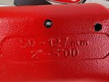 a close up of a red fire hydrant on a table