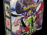 a close up of a box of pokemon cards on a black background