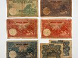 six different bank notes with different designs on them on a white surface