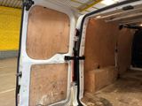 a white van that has a door open in a building