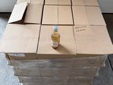 a carton of boxes with a bottle of liquid on it