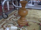 a lamp that is sitting on a rug on the floor