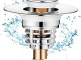 un gros plan sur le siphon d'un évier d'où s'écoule de l'eau