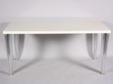 an image of a white table with clear legs